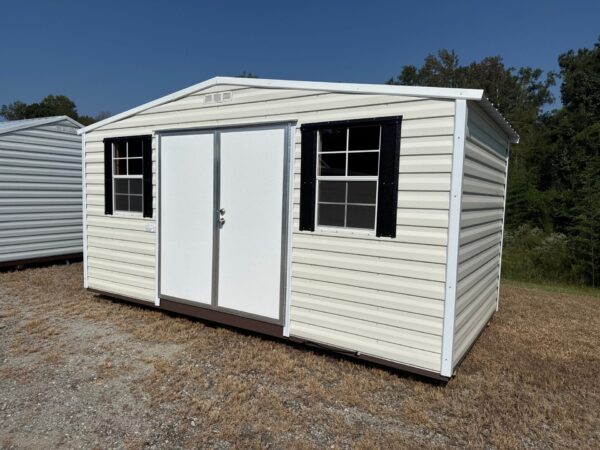 The 8x12 Ridgeline Shed #022041155, with double doors and black-shuttered windows, sits on dry grass under a blue sky.